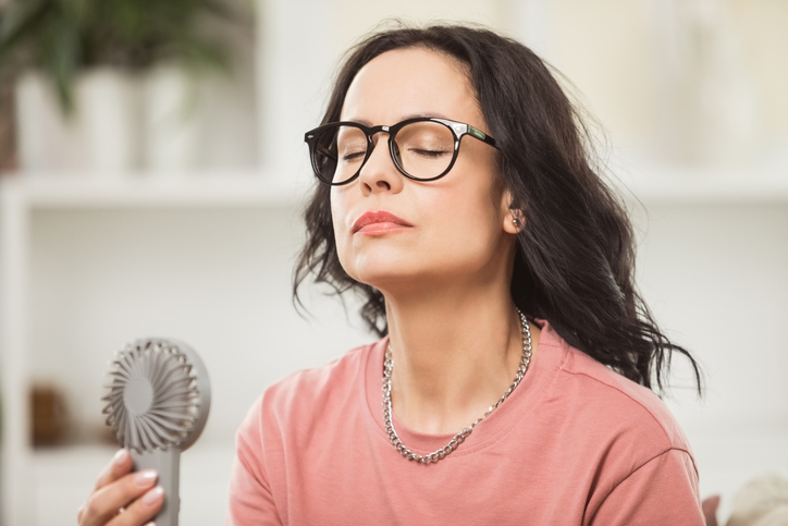 Menopausal woman having a hot flash