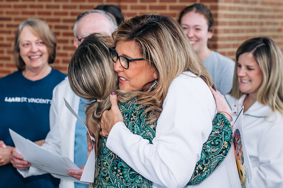 Lisa Costa hugs Taylor England Calvert at UAB St. Vincent’s.