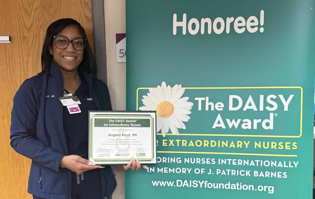 Angela Boyd, RN stands at UAB St. Vincent's East with her DAISY Award