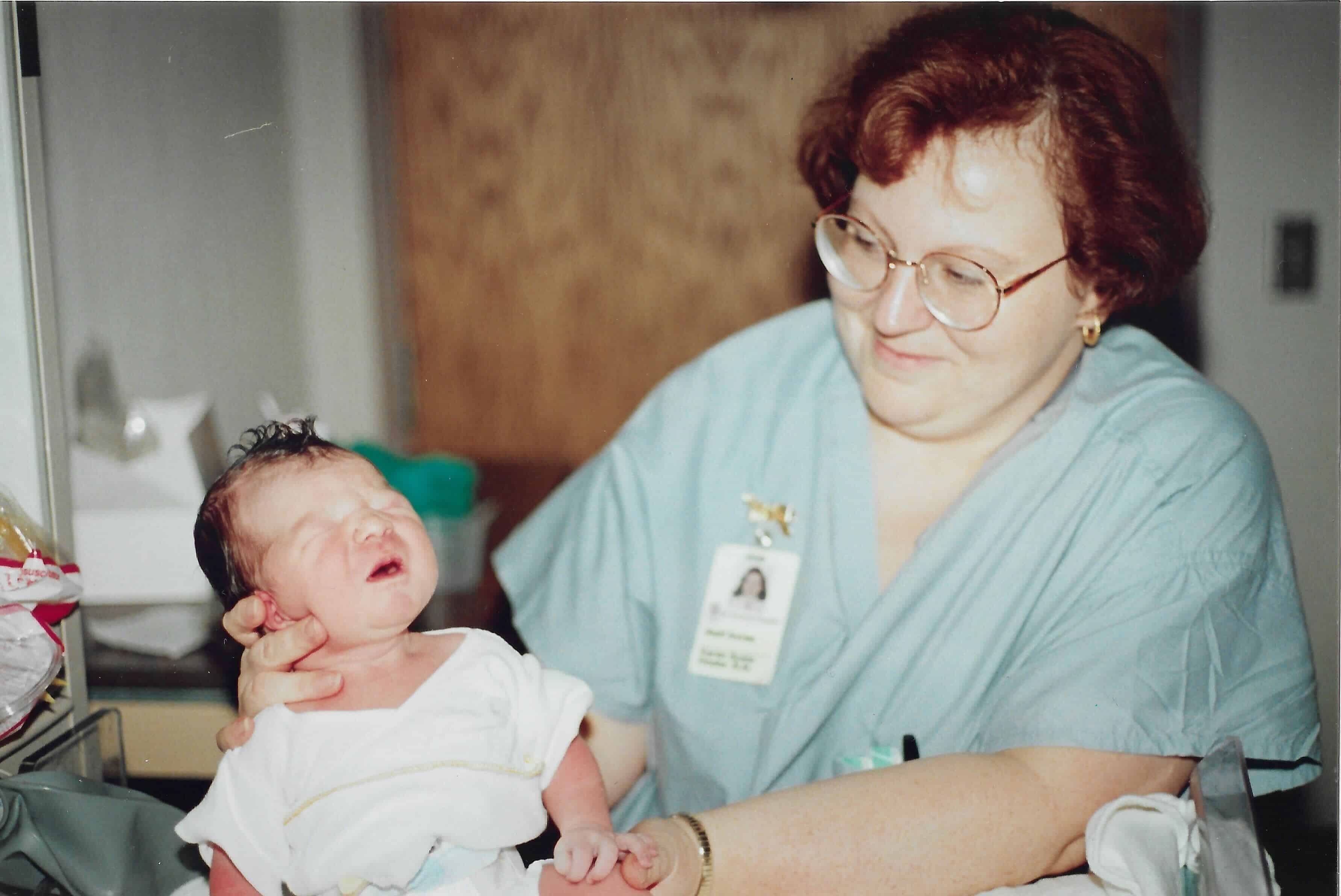 Susie Hooks assisting the delivery of Brenna Tenney.