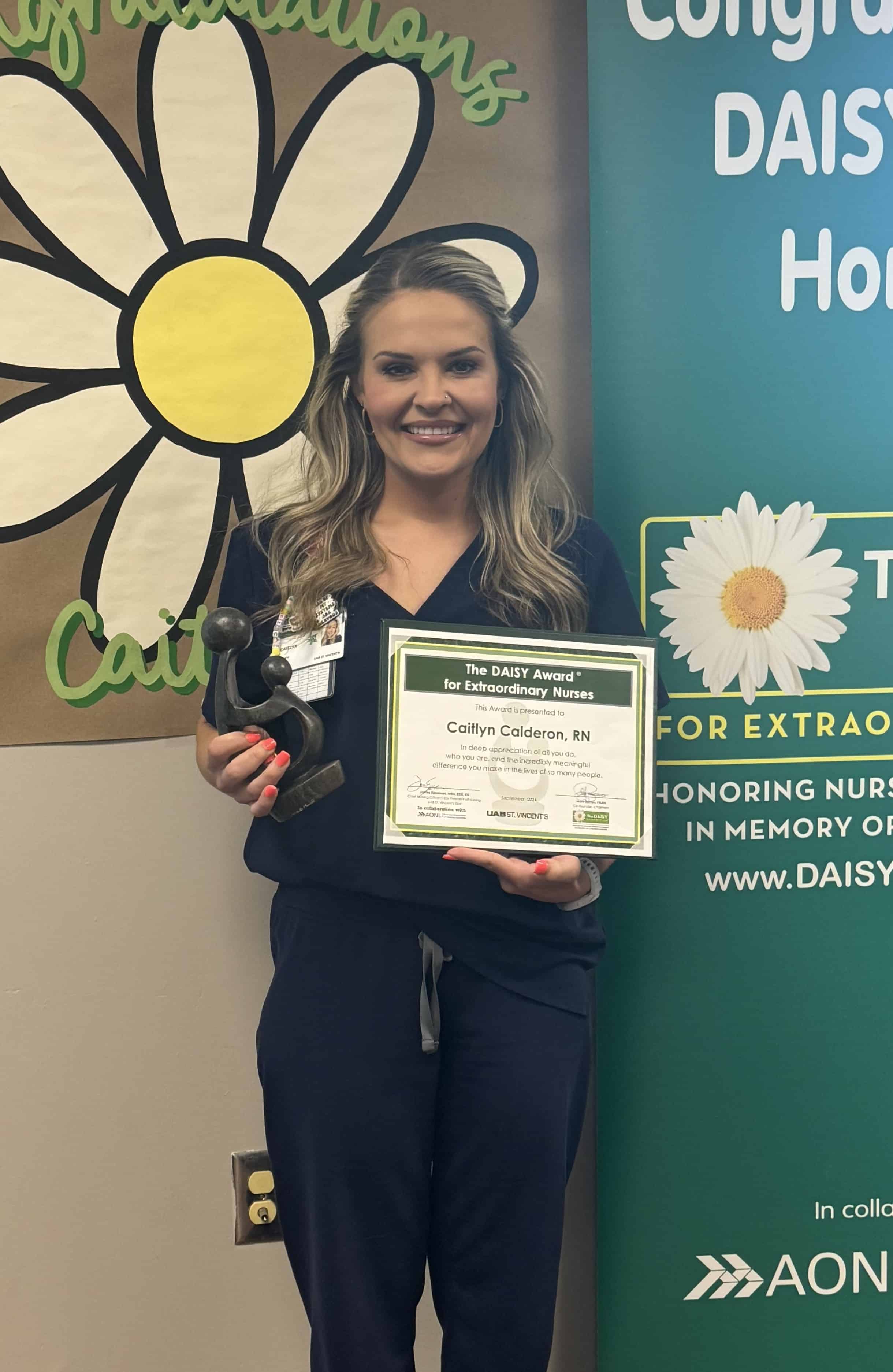 Caitlyn Calderon stands with her DAISY award